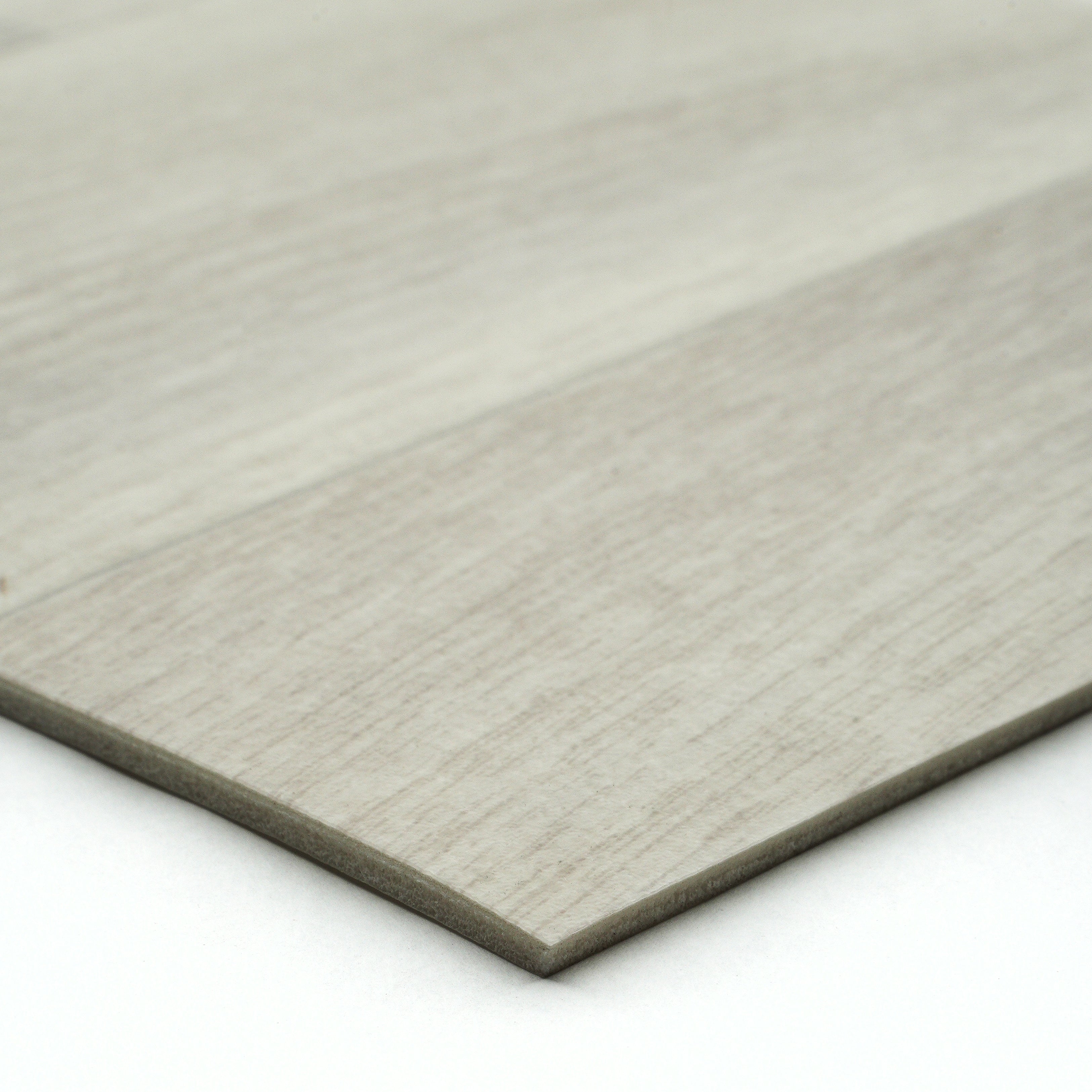 Light gray wood laminate flooring planks with textured finish for modern interior designs.