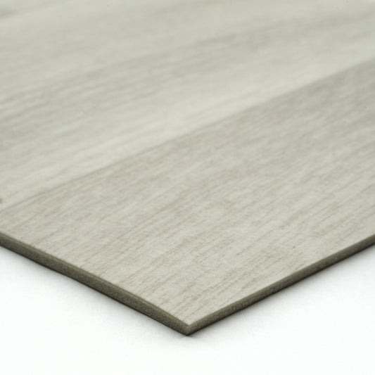 Light gray wood laminate flooring planks with textured finish for modern interior designs.
