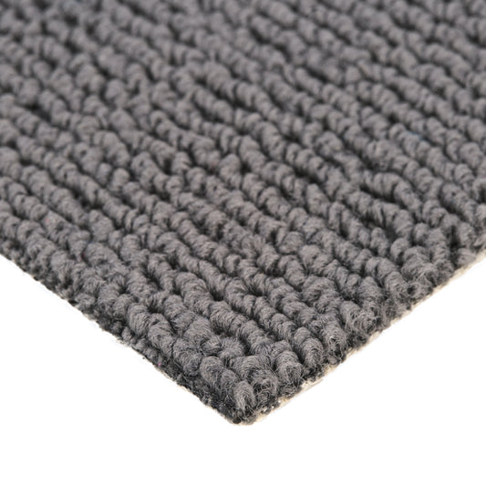Textured gray woven area rug, durable material, ideal for home decor or outdoor use.