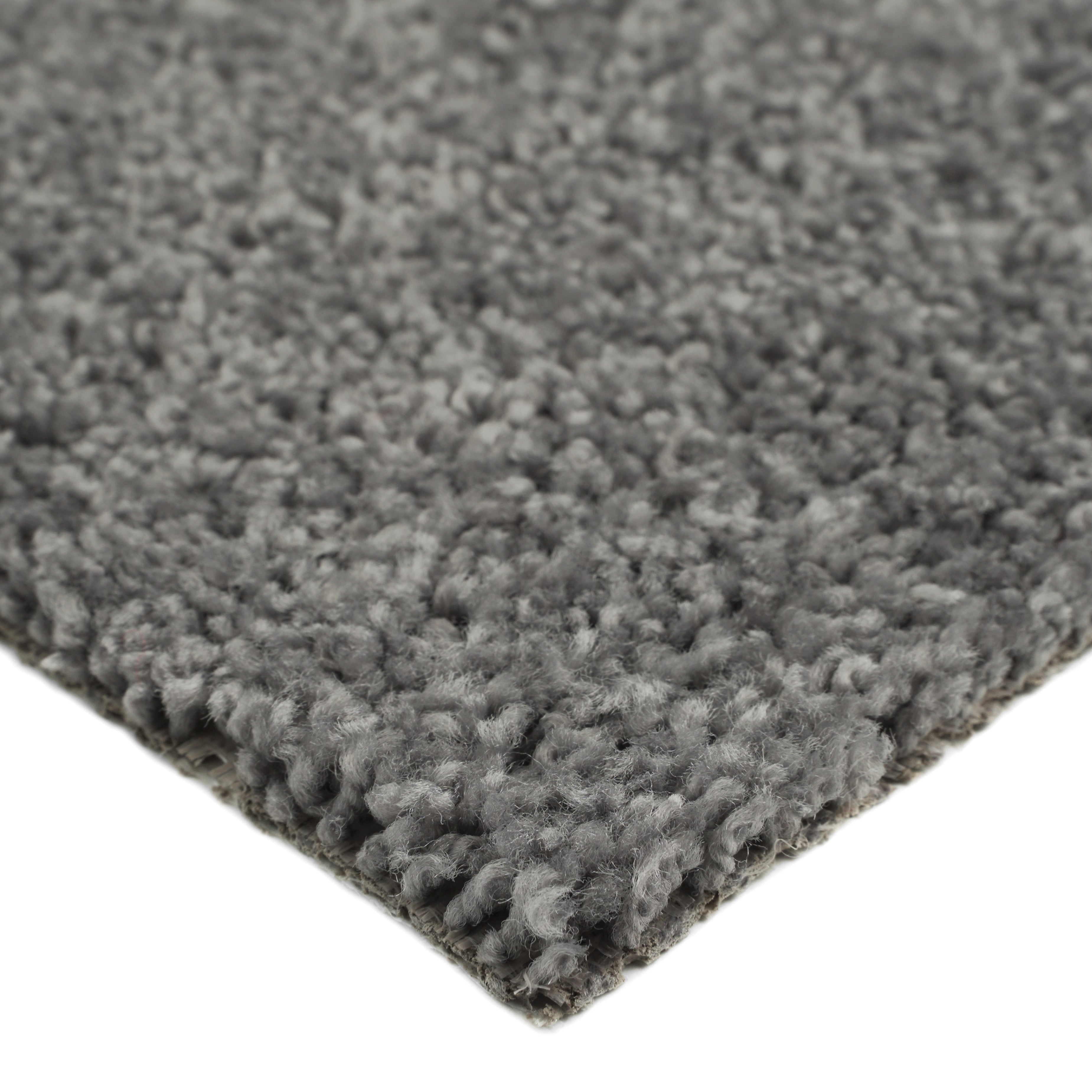 Soft gray shag rug, plush texture, ideal for living room or bedroom, adds warmth and comfort to any space.