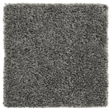 Soft gray plush carpet square, perfect for cozy home decor or as a stylish area rug.