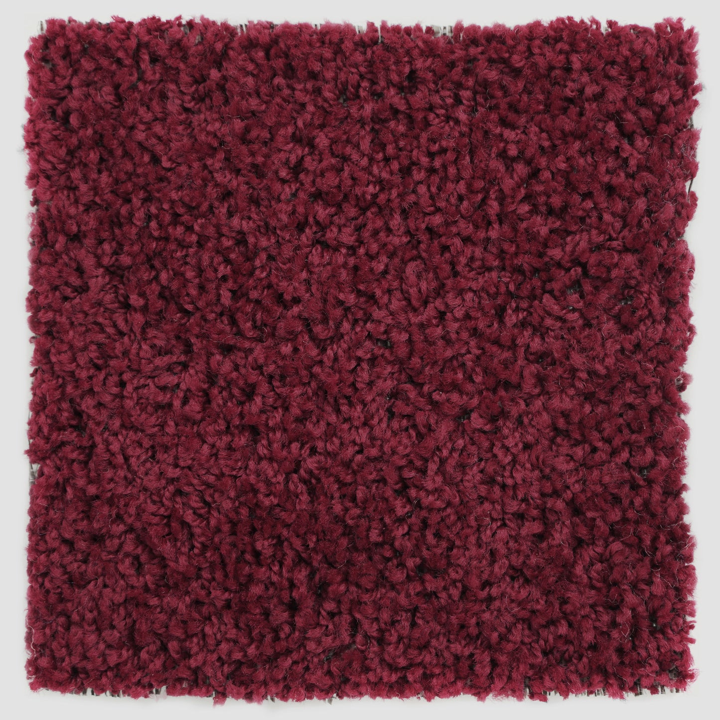Plush burgundy area rug, soft texture, perfect for adding warmth to any room.
