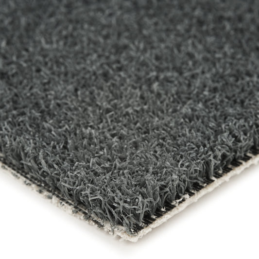Dark gray artificial grass mat with textured surface, ideal for landscaping or indoor decor.
