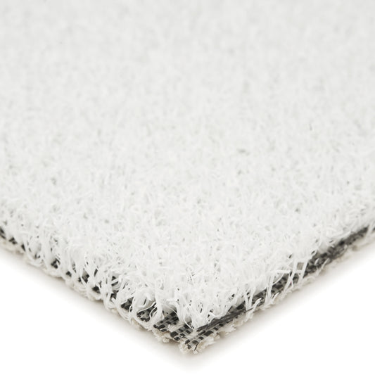 Close-up of a white synthetic turf material, ideal for outdoor spaces and landscaping.