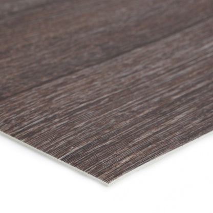 Close-up of dark wood laminate flooring, featuring a textured surface and a durable, waterproof design.