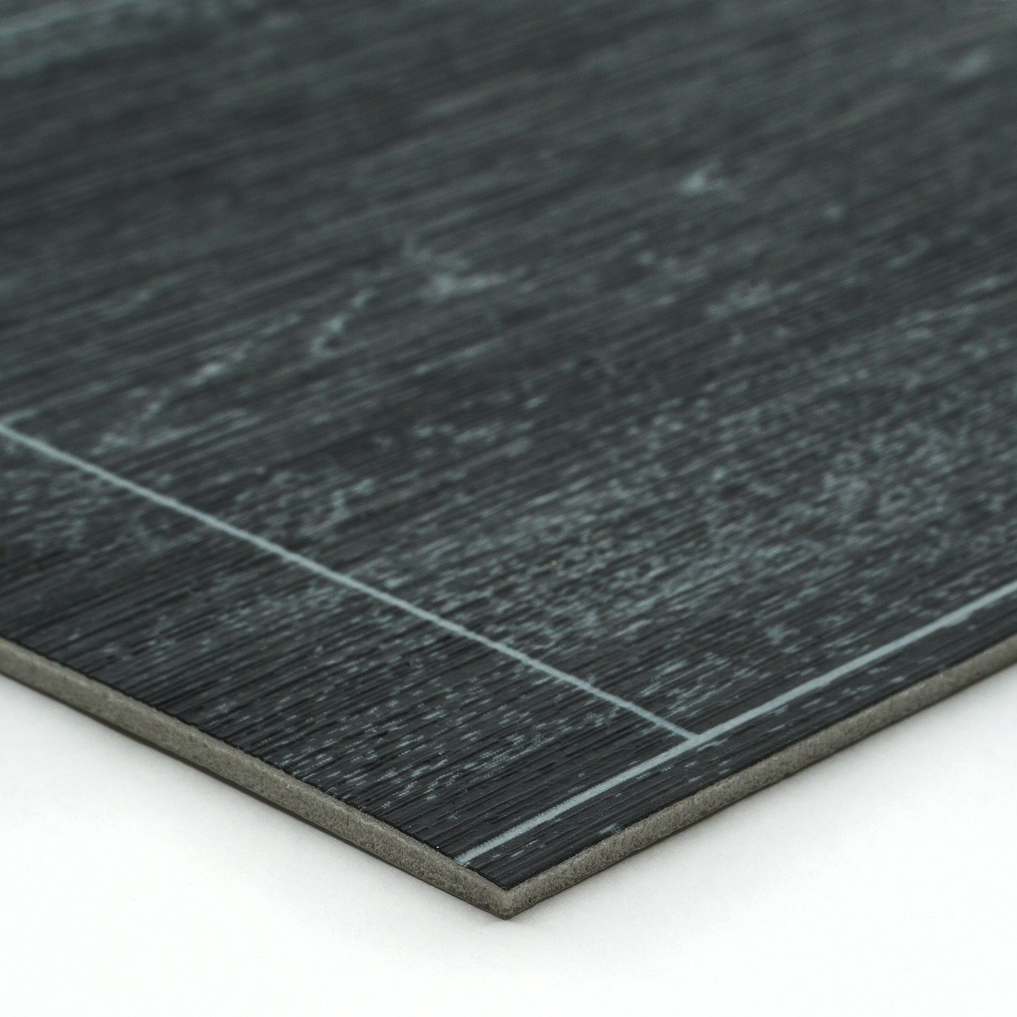 Dark gray laminate flooring with textured wood finish and smooth edge, ideal for modern interiors.