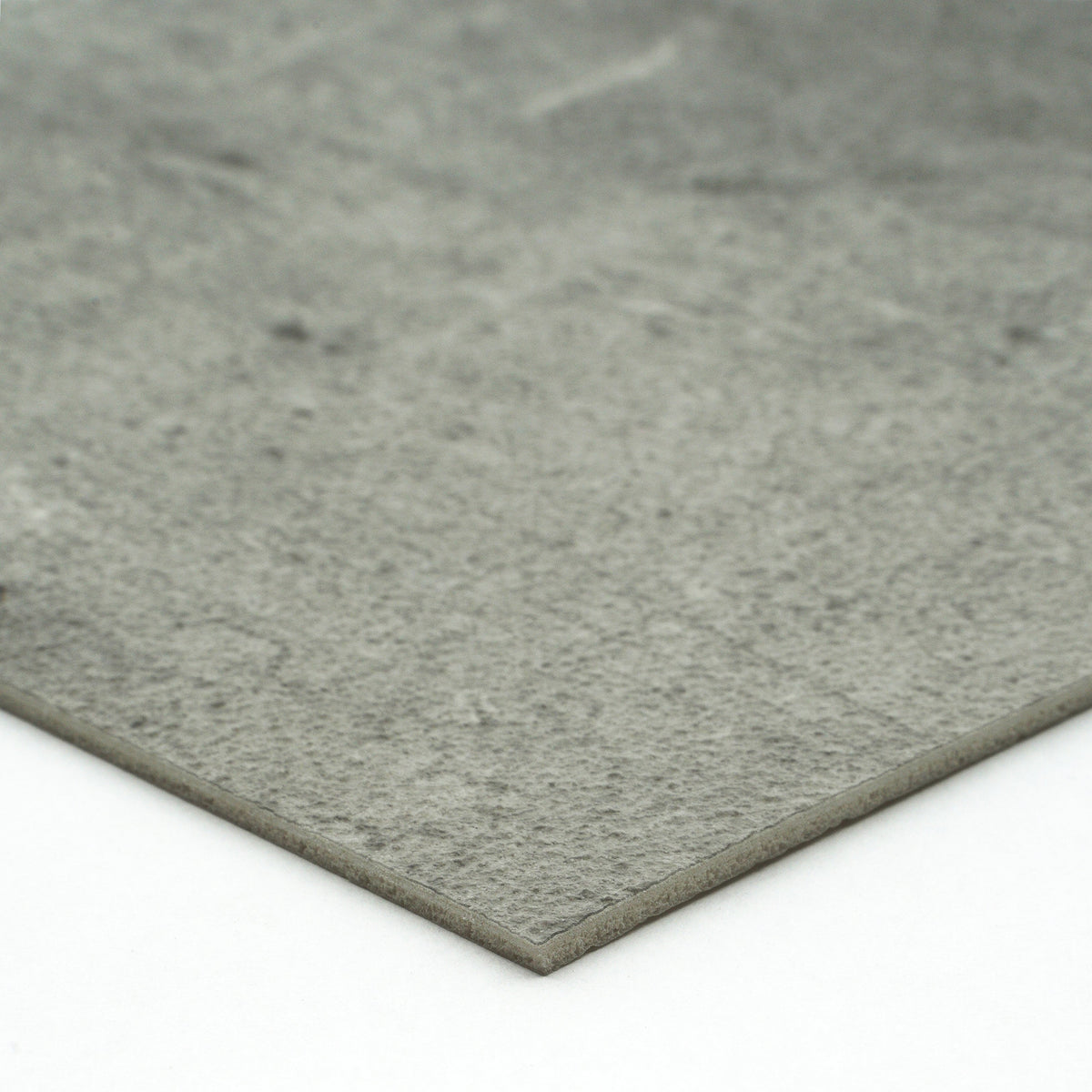 Gray textured stone slab, ideal for flooring or countertops, made from durable composite material.