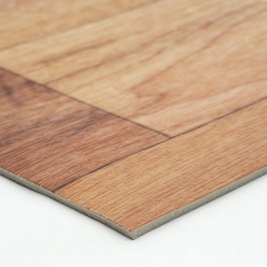 Close-up of brown wood laminate flooring with a smooth finish and durable backing material.