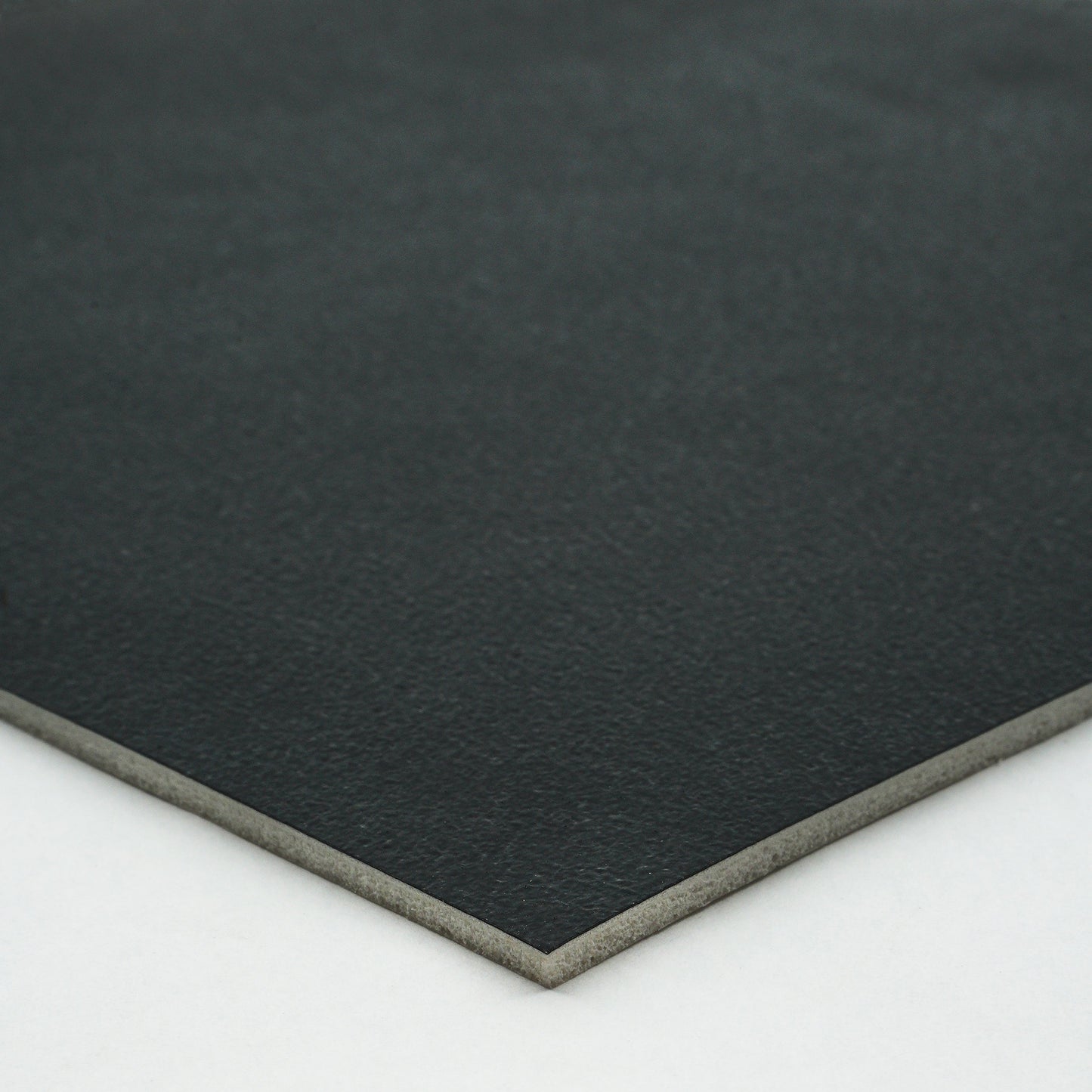 Black premium leatherette sheet with smooth texture and sturdy backing, ideal for crafting and upholstery.