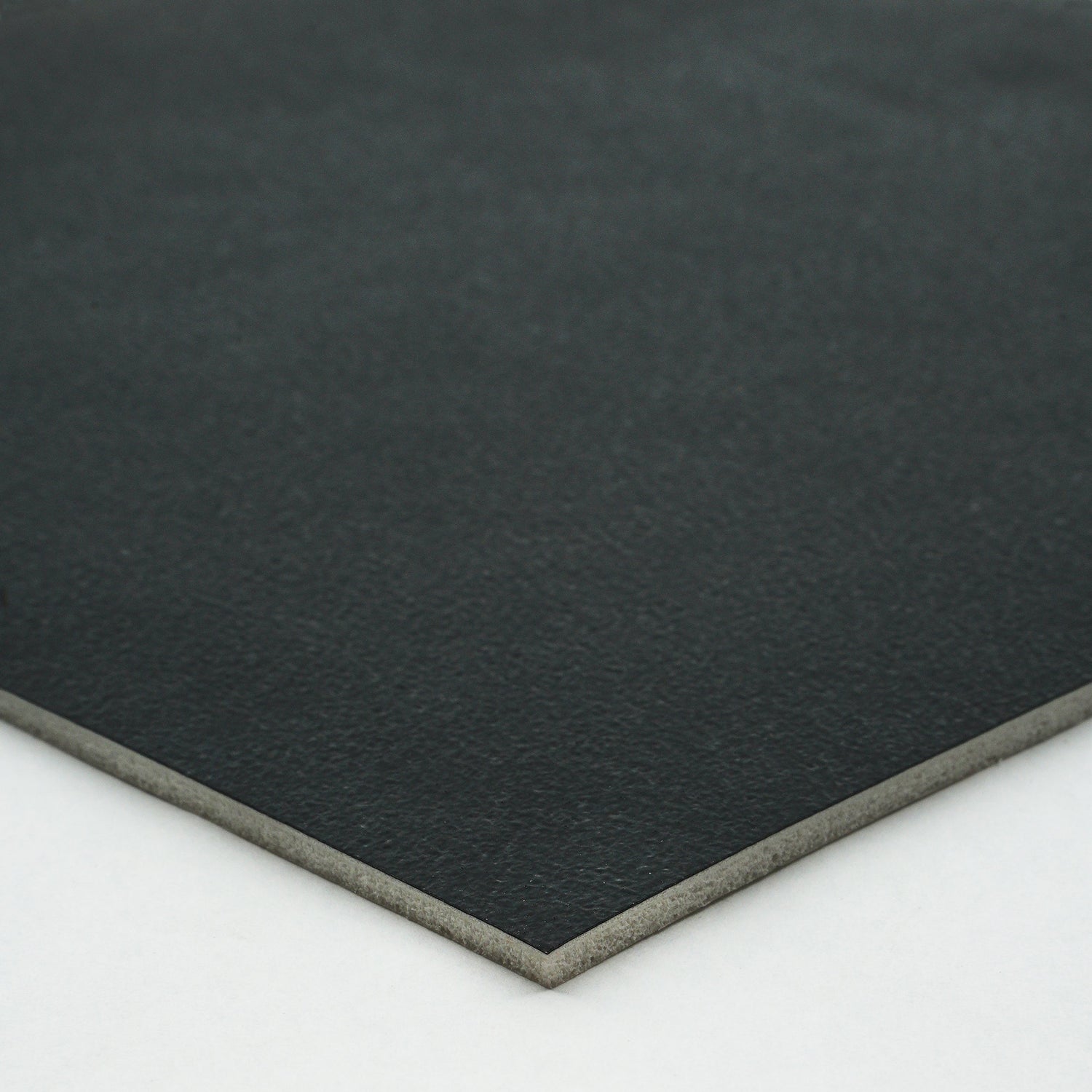 Black premium leatherette sheet with smooth texture and sturdy backing, ideal for crafting and upholstery.