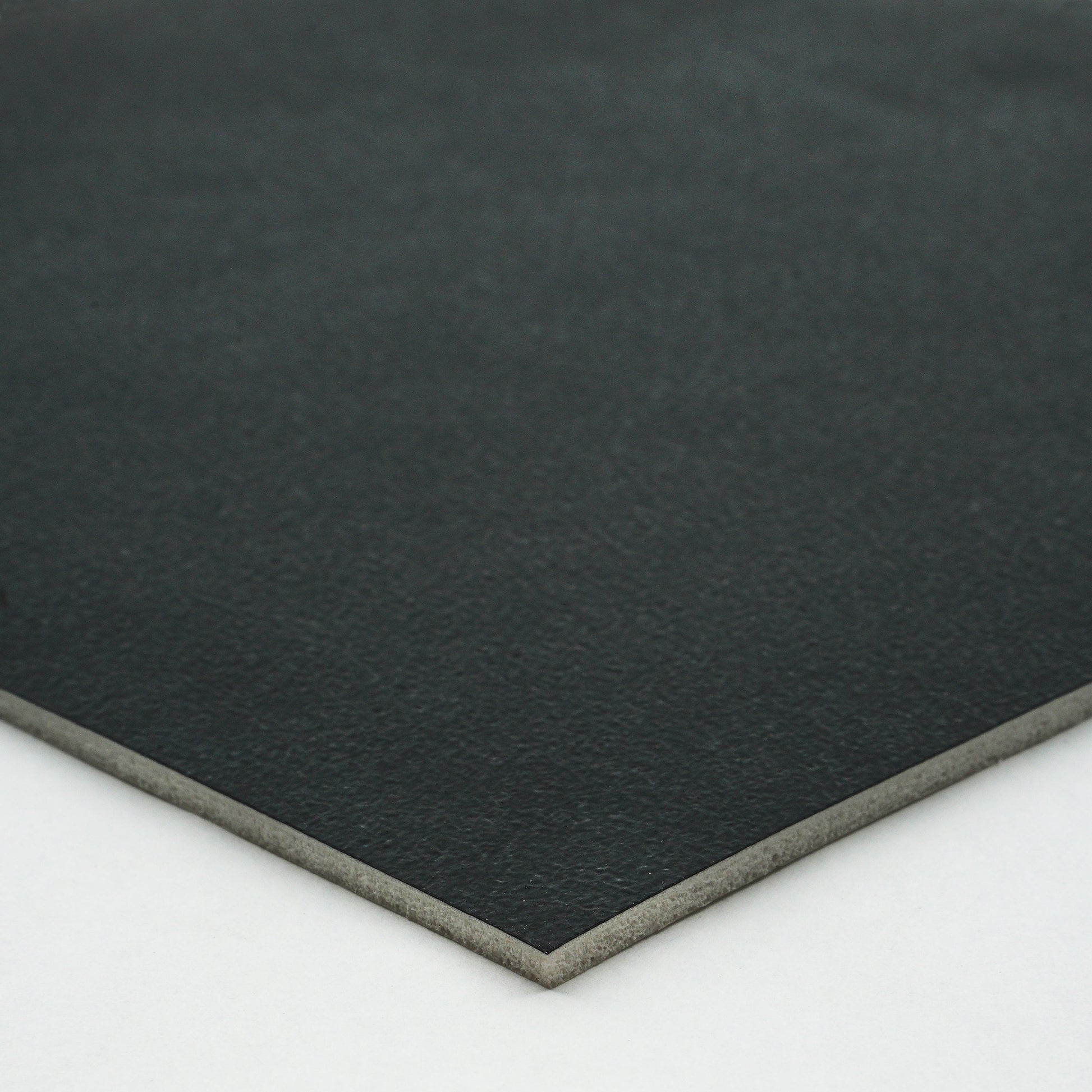 Black premium leatherette sheet with smooth texture and sturdy backing, ideal for crafting and upholstery.