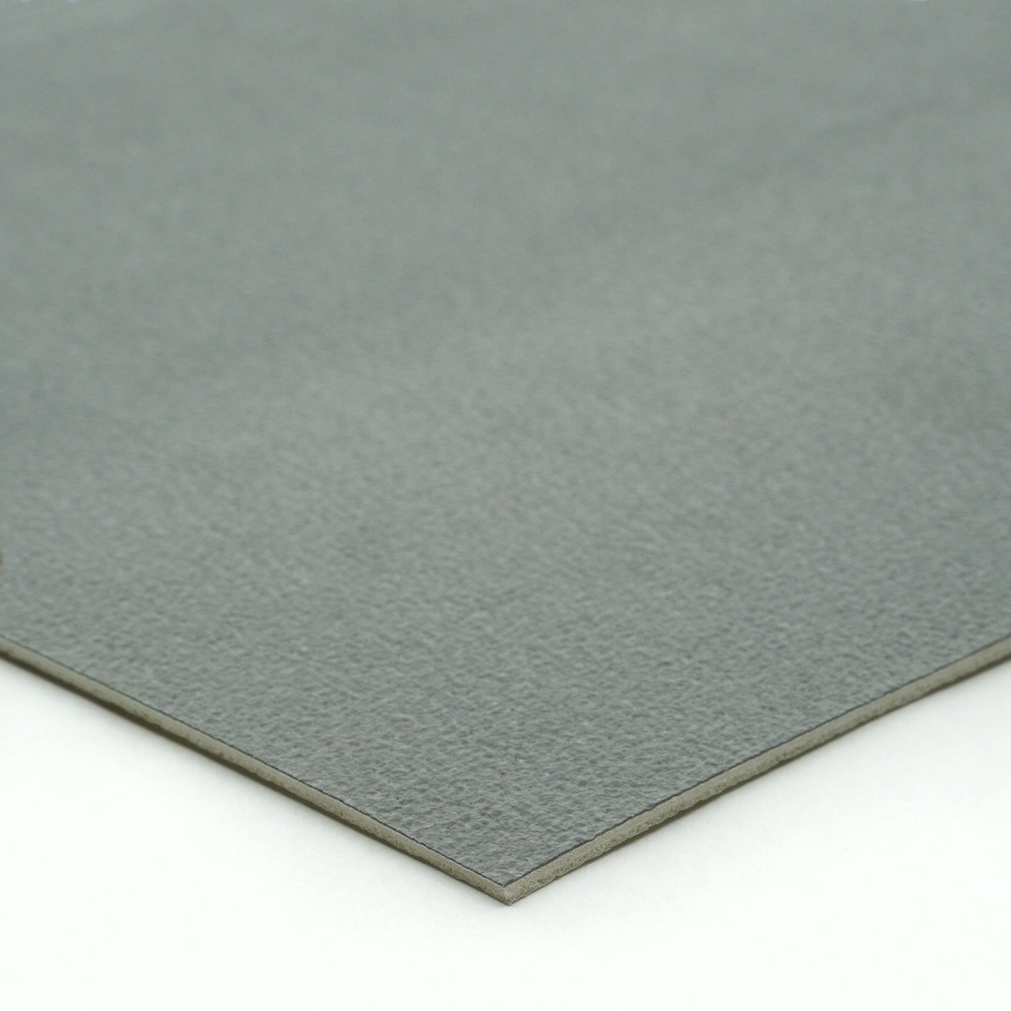 Gray suede fabric sheet, soft texture, ideal for crafts and upholstery projects.
