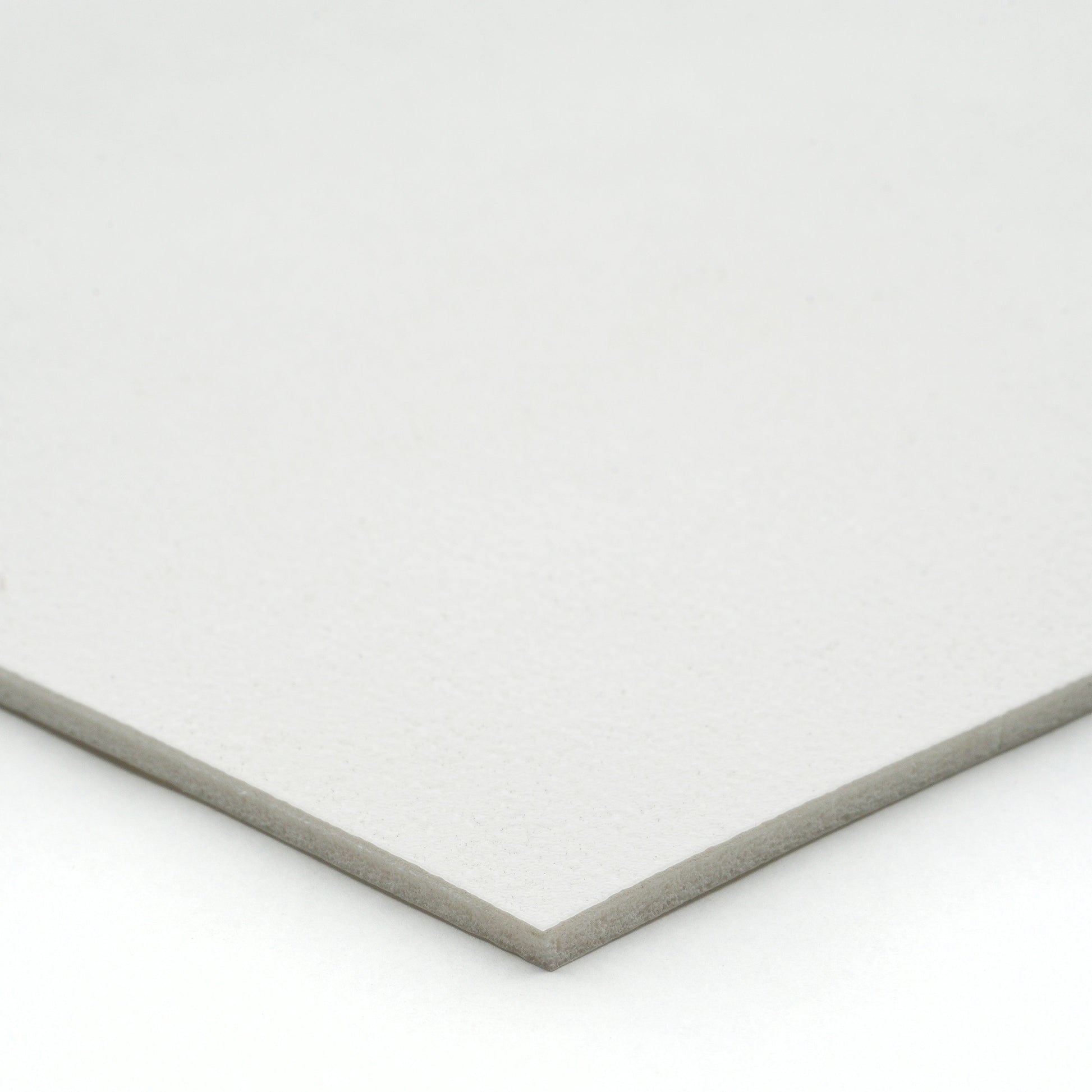 White textured cardstock, ideal for crafting and printing projects,  thick and durable material.