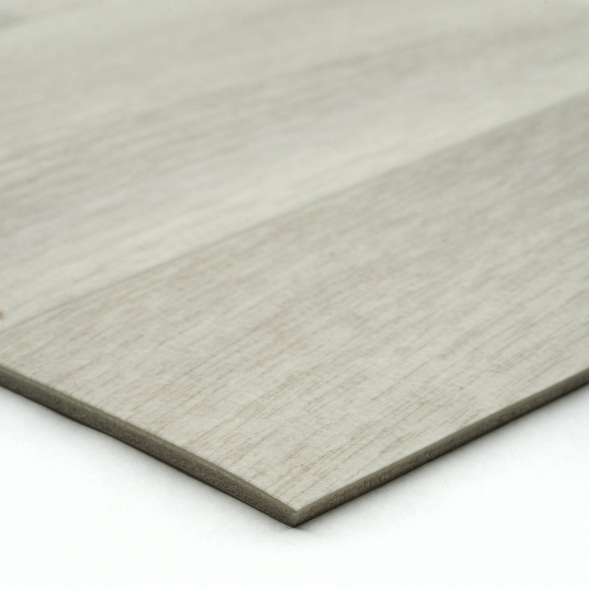 Light gray wood laminate flooring planks with textured finish for modern interior designs.