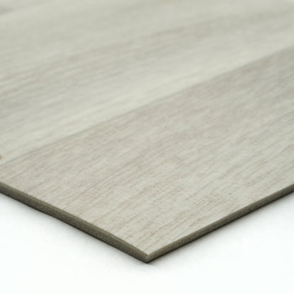 Light gray wood laminate flooring planks with textured finish for modern interior designs.
