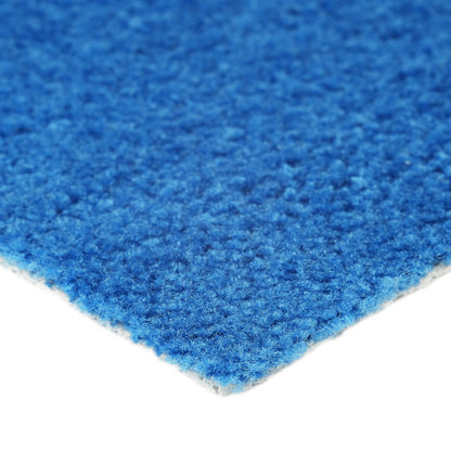 Close-up of vibrant blue carpeting, soft texture, ideal for home decor or office use.