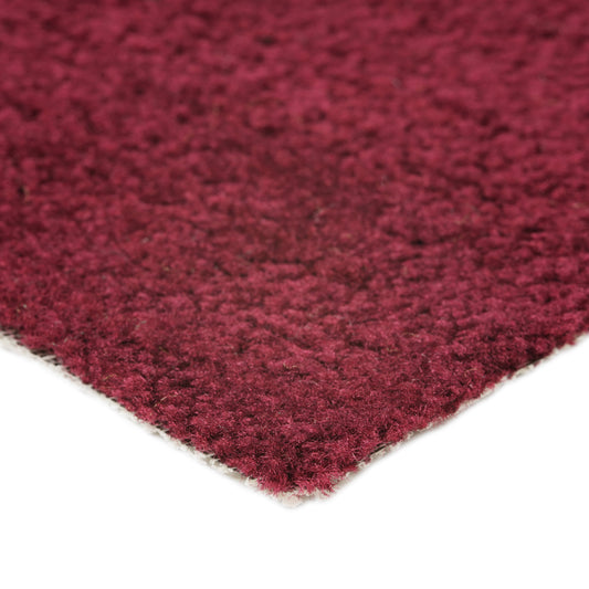 Plush burgundy area rug made of soft synthetic fibers, perfect for cozy home decor.