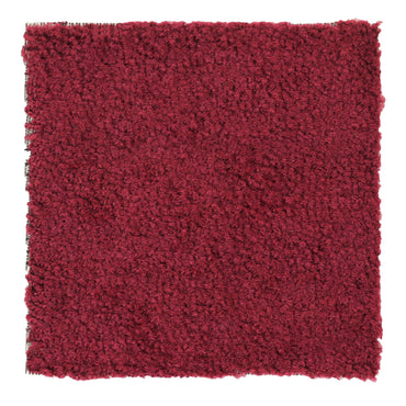 Soft burgundy shag rug, plush texture, perfect for cozy living spaces or bedrooms.