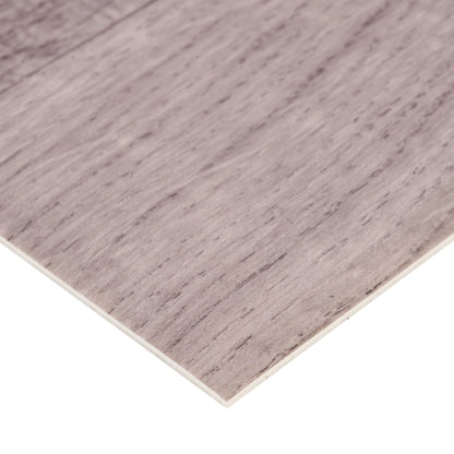Gray laminate flooring with a textured wood finish, ideal for modern interior design.