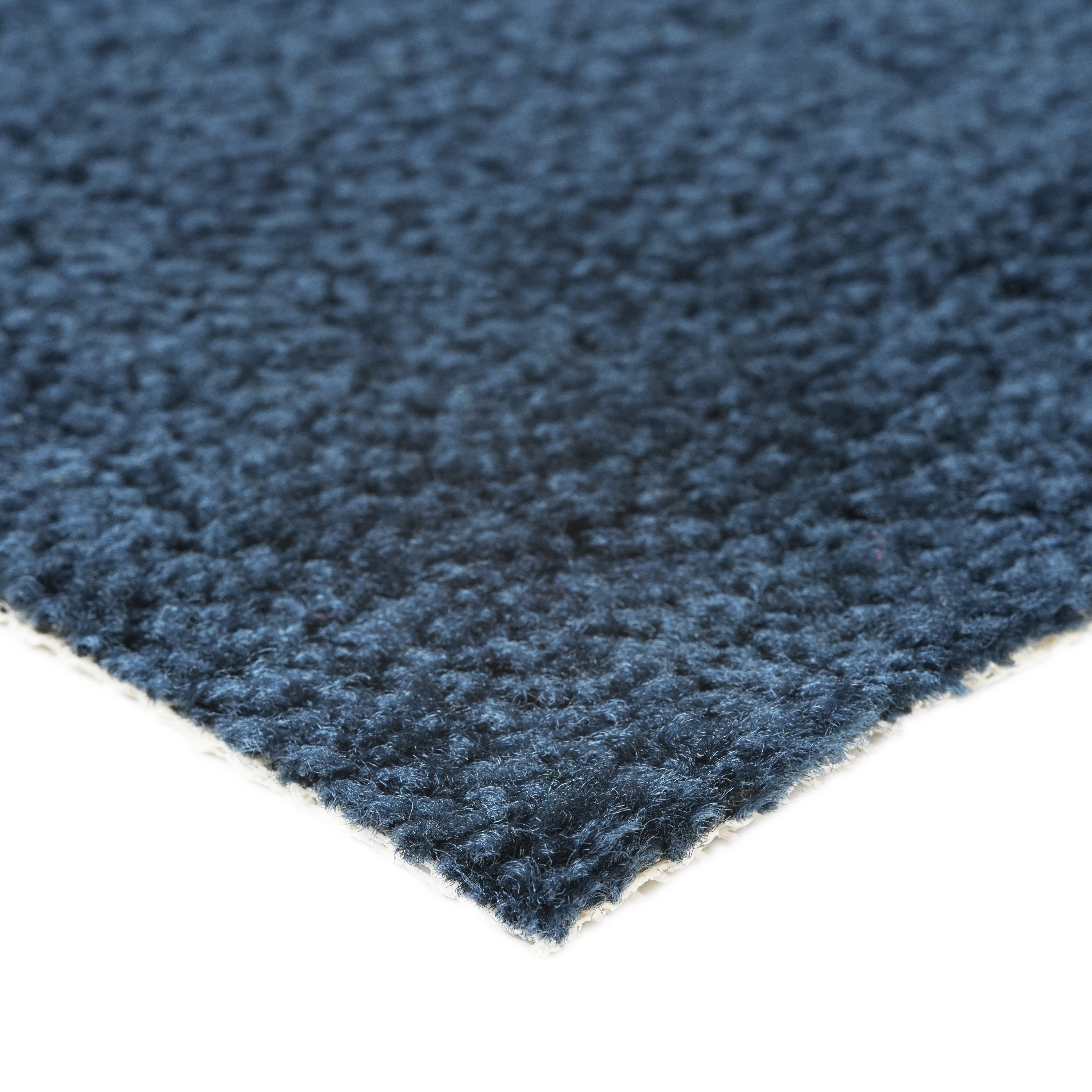 Soft navy blue carpet with textured surface, perfect for adding warmth to any room.