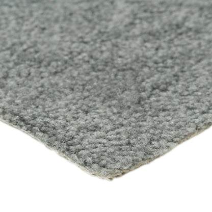 Fluffy grey area rug made of high-quality materials, perfect for adding warmth to any room.