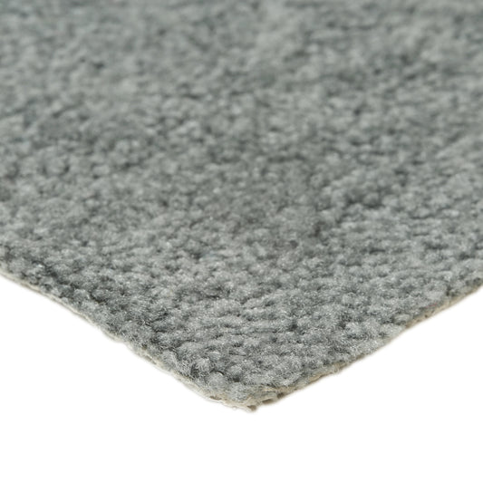 Fluffy grey area rug made of high-quality materials, perfect for adding warmth to any room.