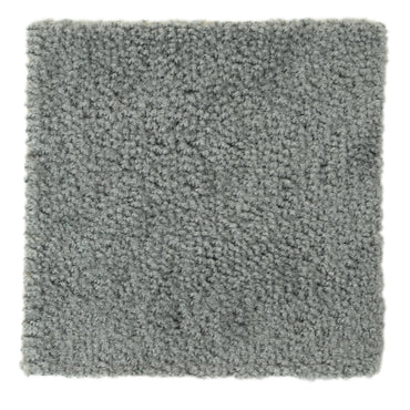 Soft gray shag rug, plush texture, perfect for cozy home decor and enhancing interior warmth.