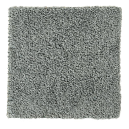 Soft gray shag rug, plush texture, perfect for cozy home decor and enhancing interior warmth.