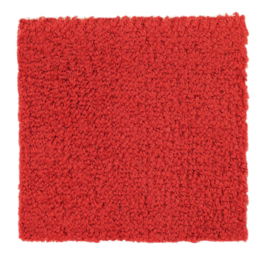 Thick red shag rug, ideal for cozying up living spaces, made from soft, durable materials for comfort.