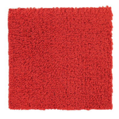 Thick red shag rug, ideal for cozying up living spaces, made from soft, durable materials for comfort.