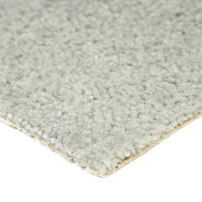 Soft gray area rug made of plush material, ideal for cozy living spaces and adding warmth to decor.