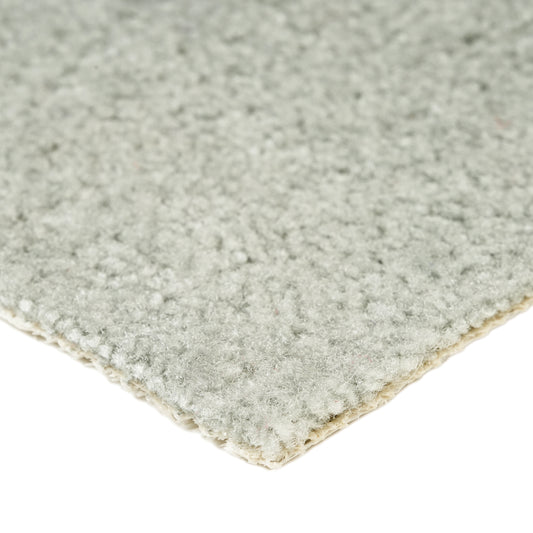 Soft gray area rug made of plush material, ideal for cozy living spaces and adding warmth to decor.