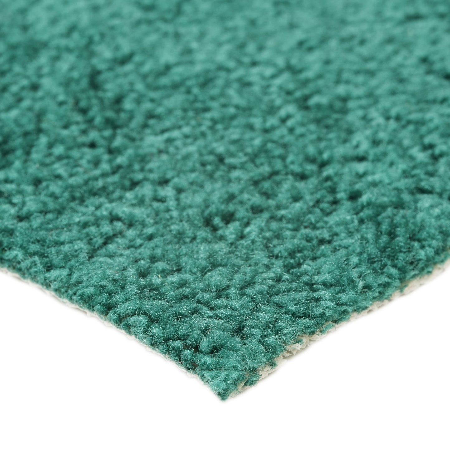 Soft teal area rug with a plush texture, perfect for adding comfort and color to any room.
