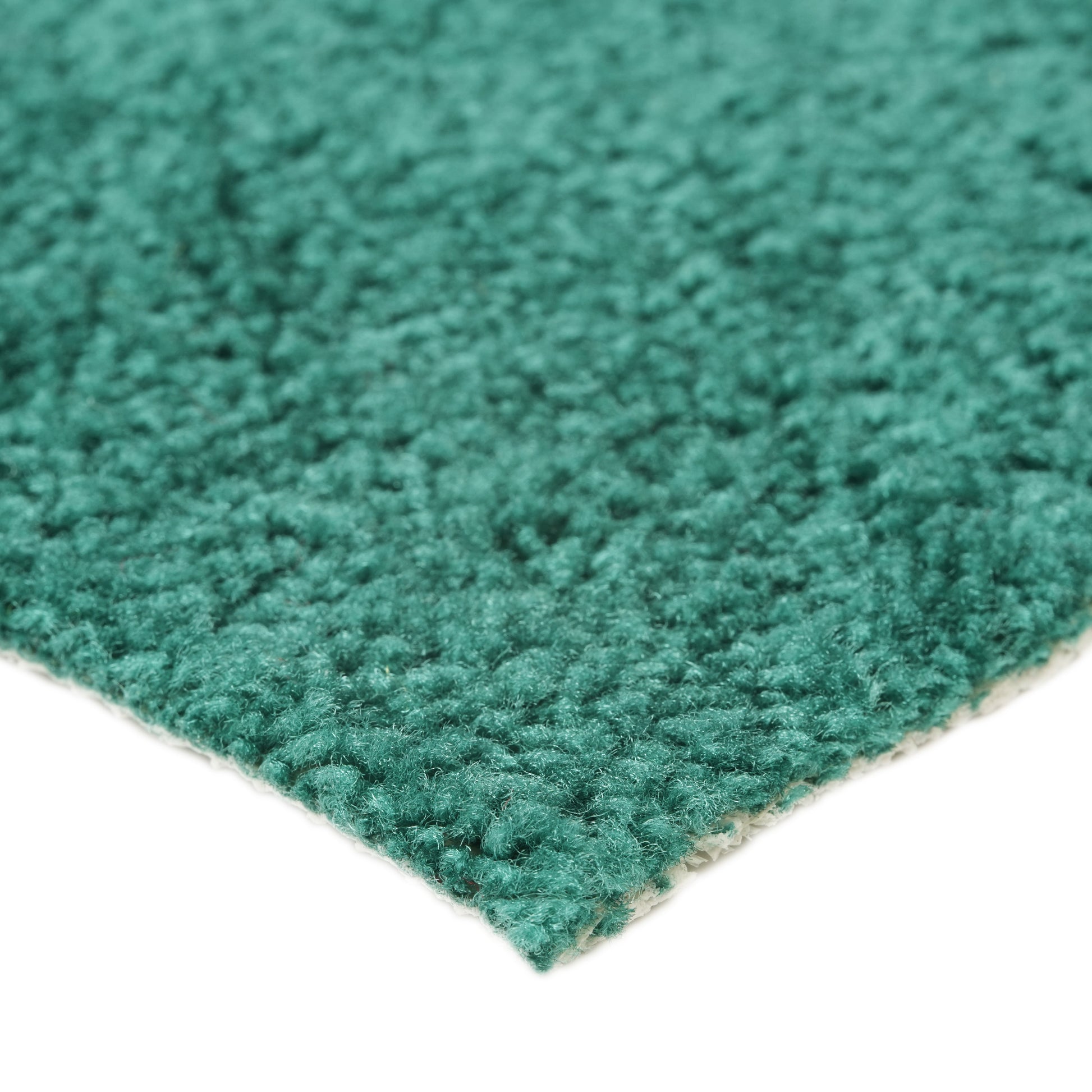 Soft teal area rug with a plush texture, perfect for adding comfort and color to any room.