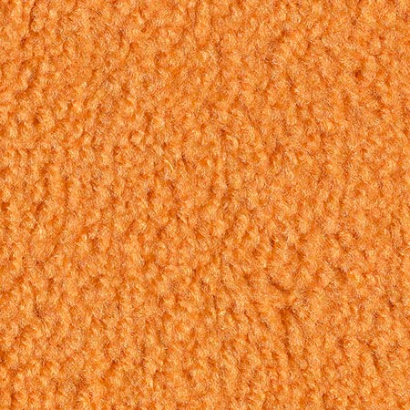 Close-up of soft orange fleece fabric, perfect for cozy clothing and home decor projects.