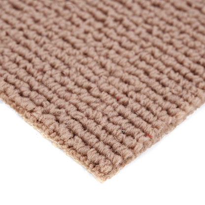 Natural beige woven cotton rug with textured finish for home decor.