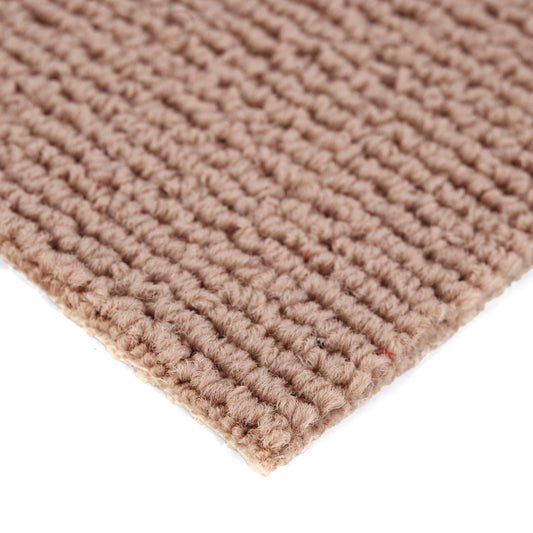 Natural beige woven cotton rug with textured finish for home decor.