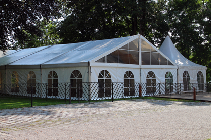Large white outdoor party tent with windows, perfect for events, weddings, and gatherings.
