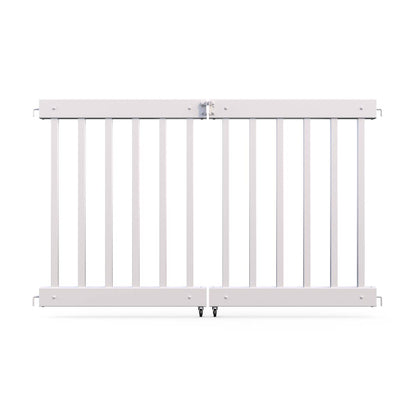White wooden safety gate with vertical slats and secure latch, perfect for childproofing spaces.