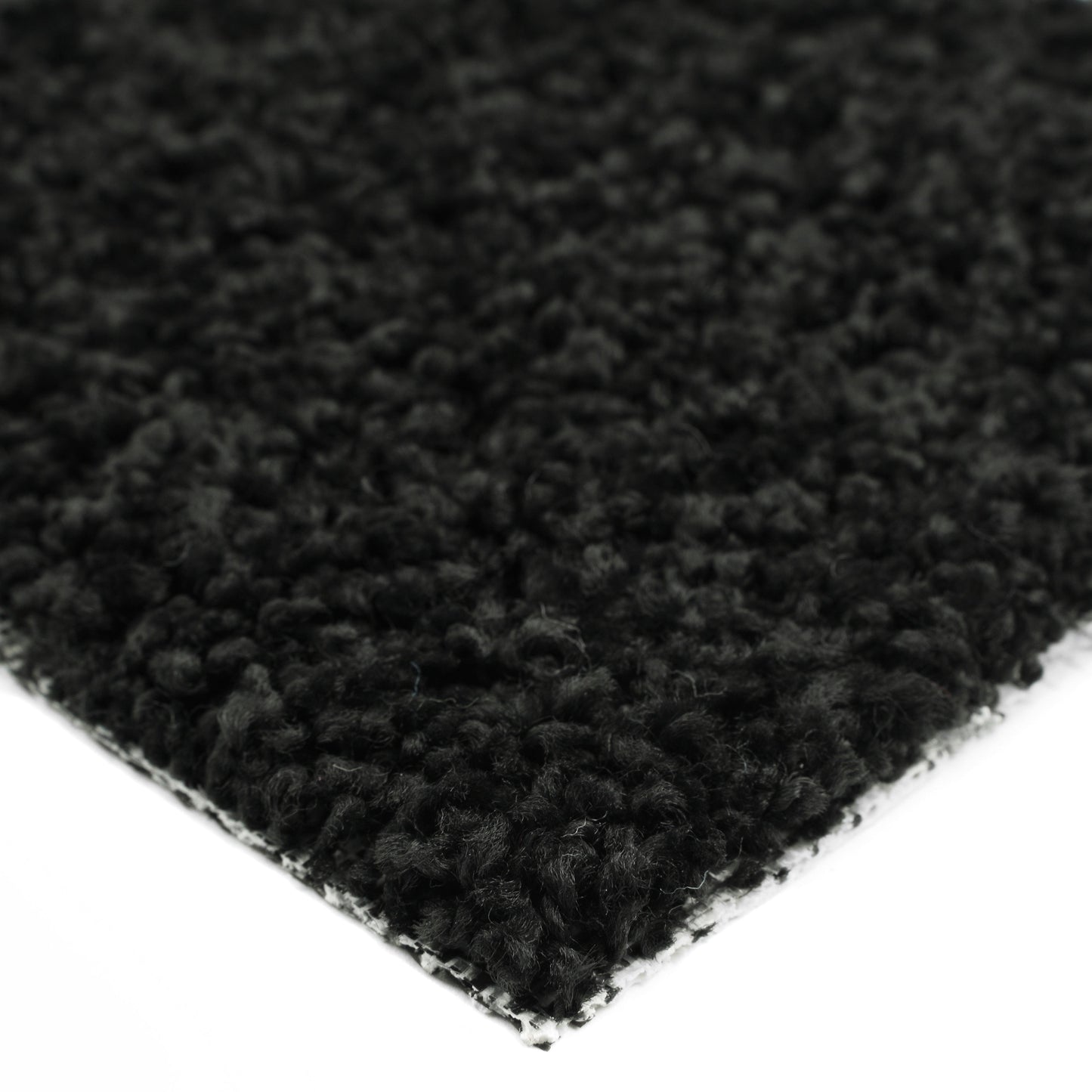 Soft black shag rug with plush texture, perfect for adding warmth to any room.