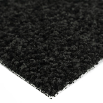 Soft black shag rug with plush texture, perfect for adding warmth to any room.
