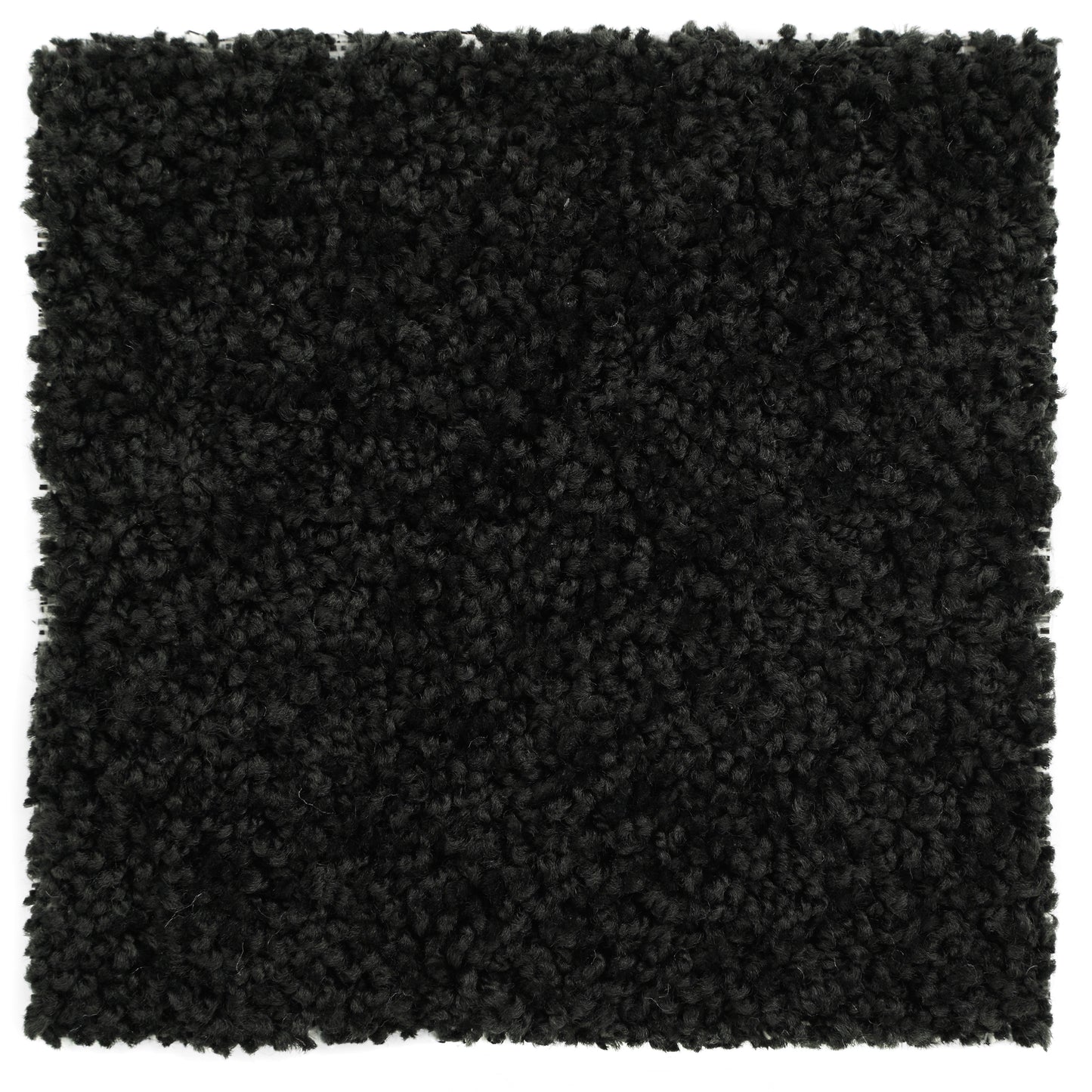 Black plush area rug, soft synthetic material, perfect for modern home decor and cozy ambiance.