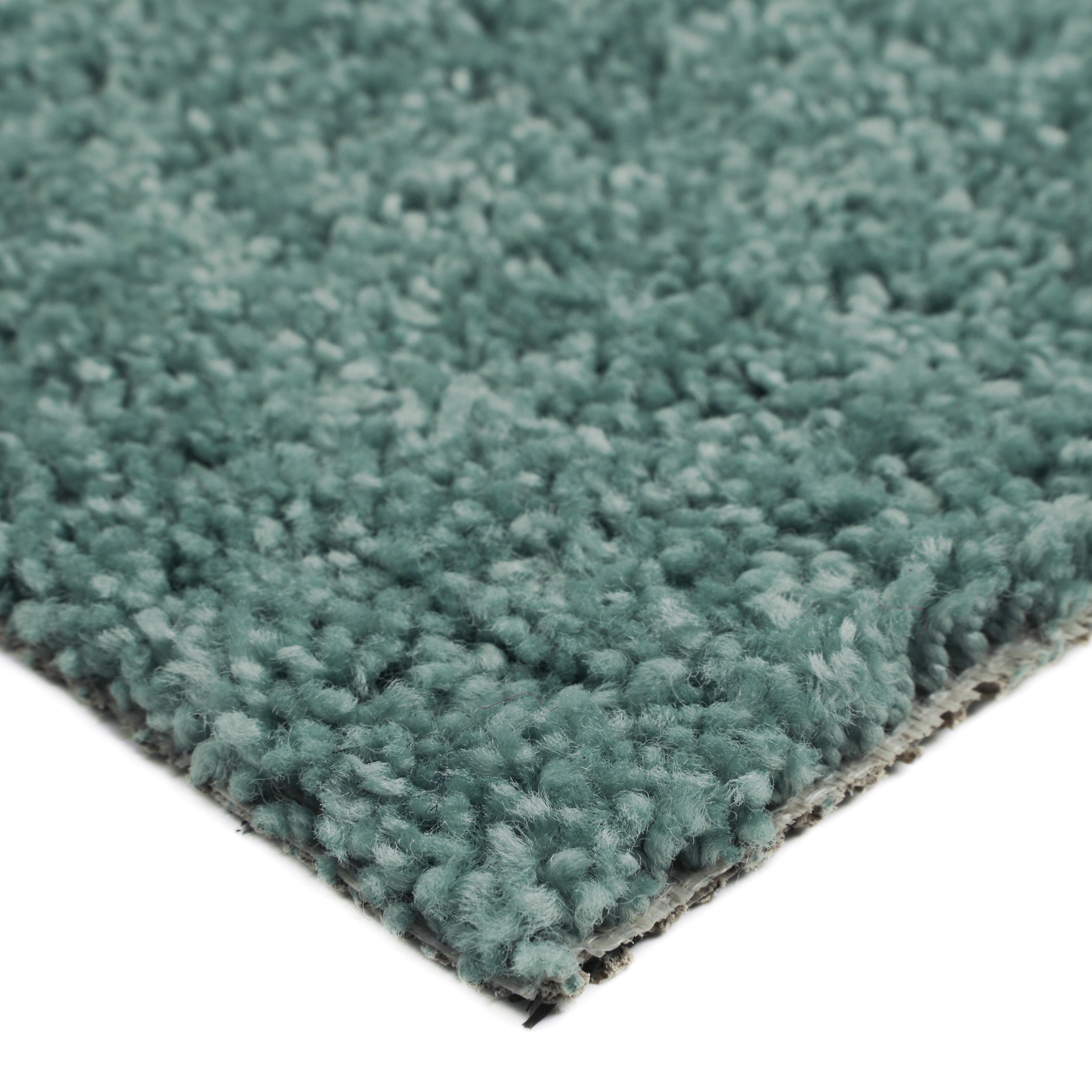 Soft teal shag rug, plush texture, perfect for adding warmth and style to any room.