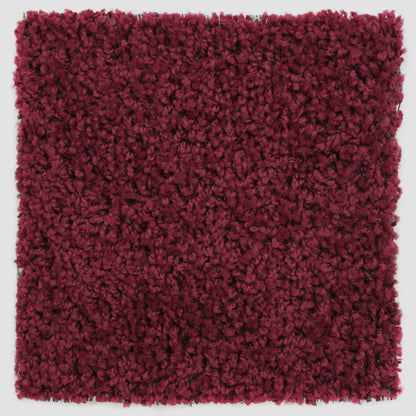 Plush burgundy area rug, soft texture, perfect for adding warmth to any room.