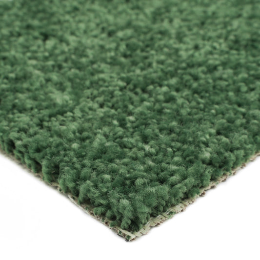 Green plush carpet rug, soft texture, ideal for home decor and cozy interiors.