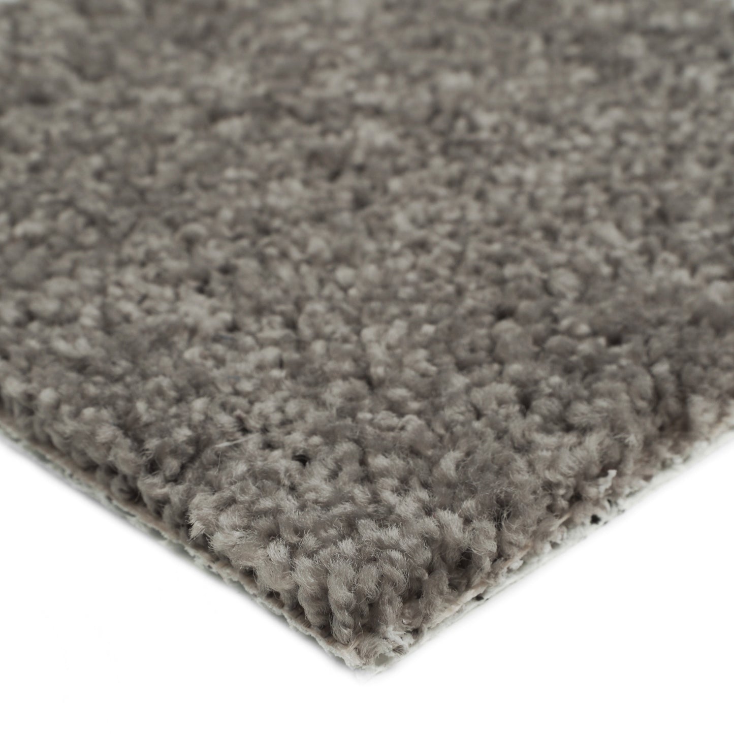 Soft gray shag rug with thick fibers, perfect for cozy living spaces.