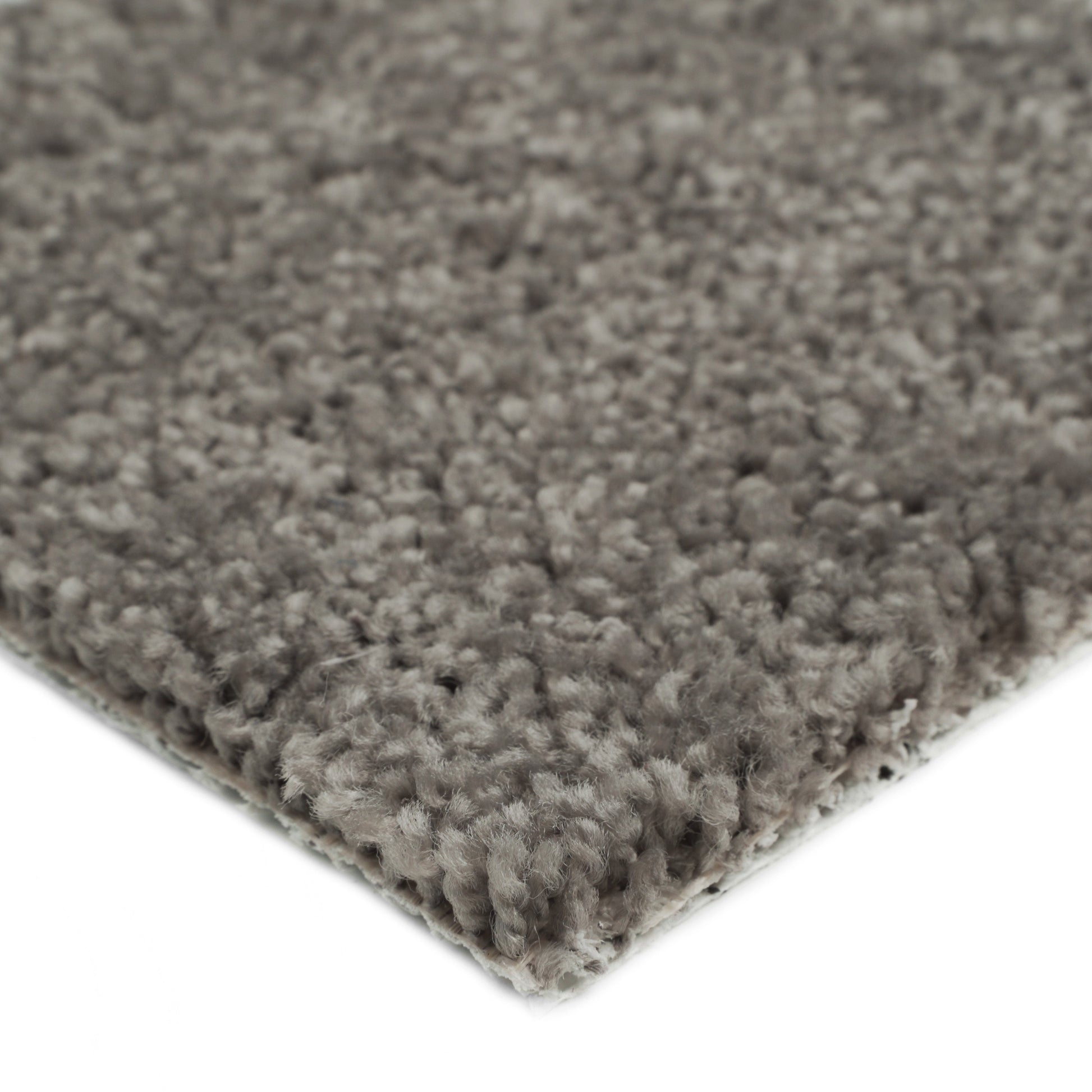 Soft gray shag rug with thick fibers, perfect for cozy living spaces.