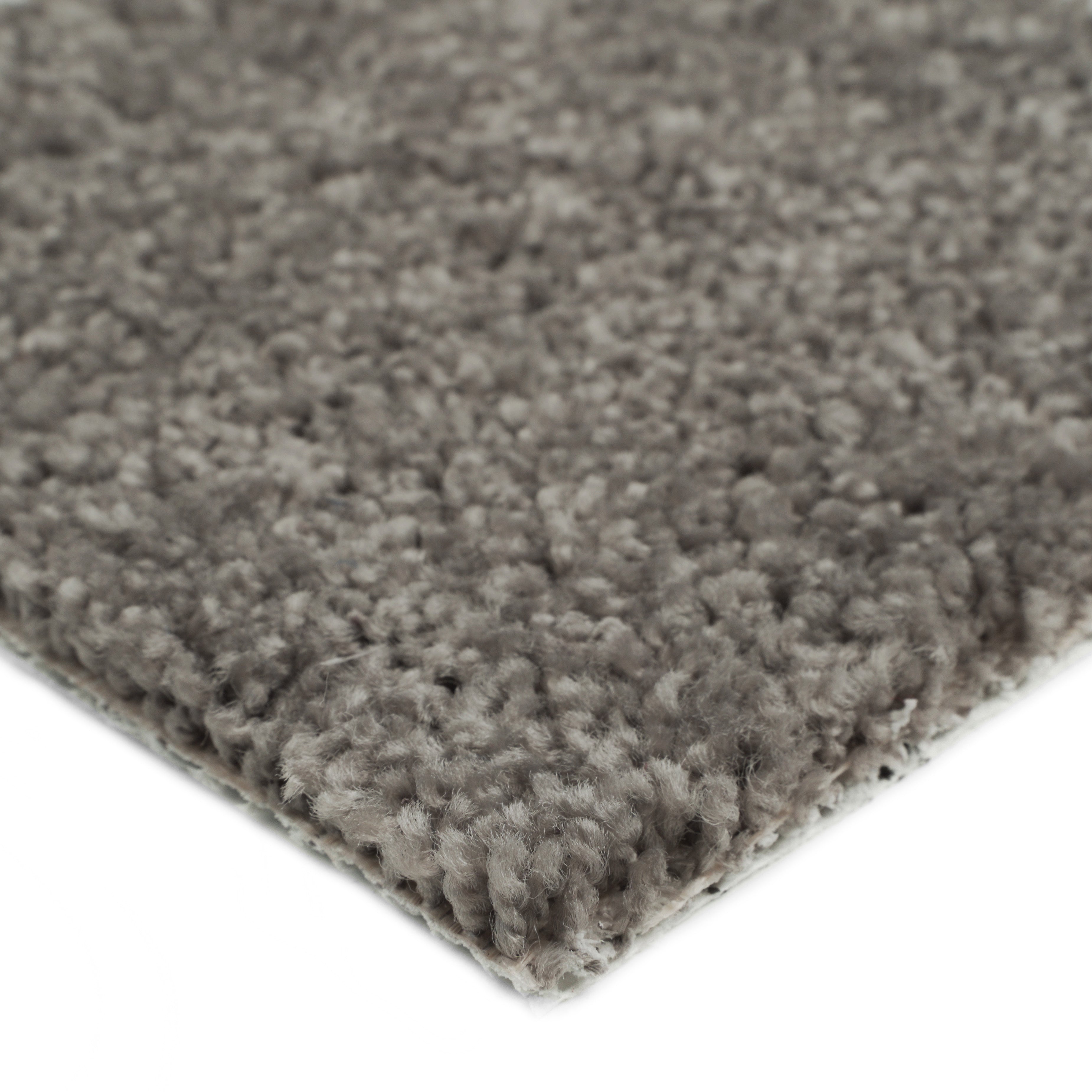 Soft gray shag rug with thick fibers, perfect for cozy living spaces.