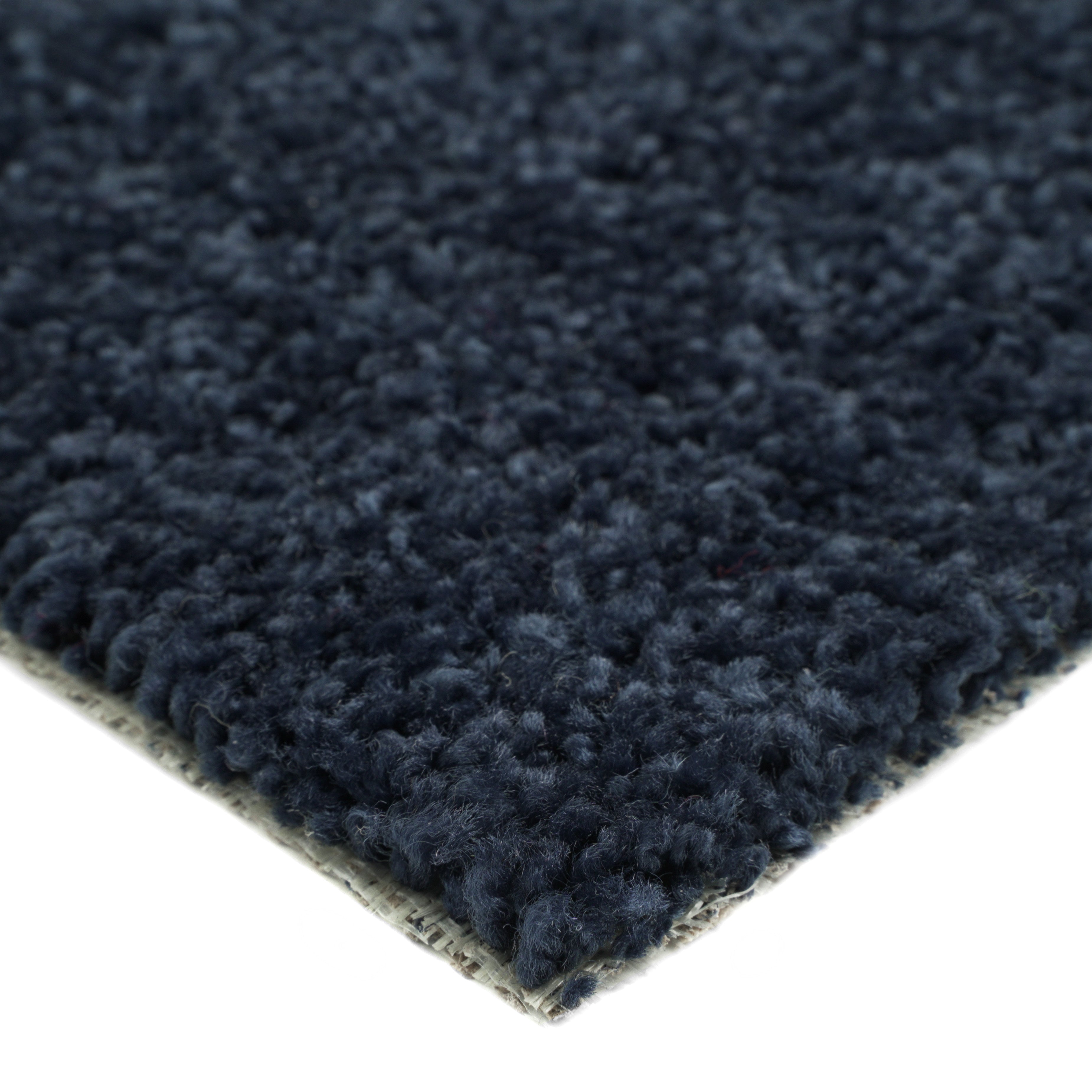 Navy blue plush area rug made of soft fabric, perfect for cozy home decor.