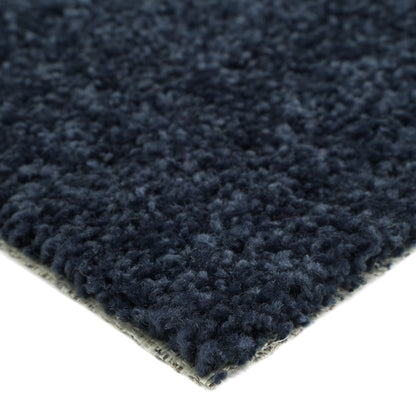 Navy blue plush area rug made of soft fabric, perfect for cozy home decor.